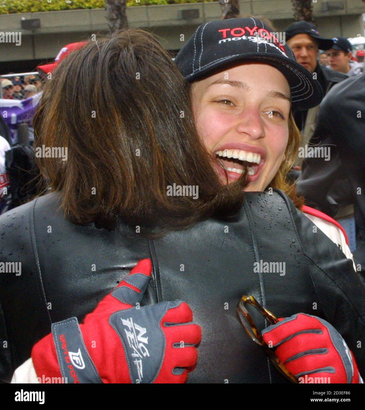 Actress Piper Perabo who recently appeared as the star in the film "Coyote  Ugly" gets a hug after finishing the celebrity race at the 25th Annual  Toyota Pro/Celebrity Race April 7, 2001