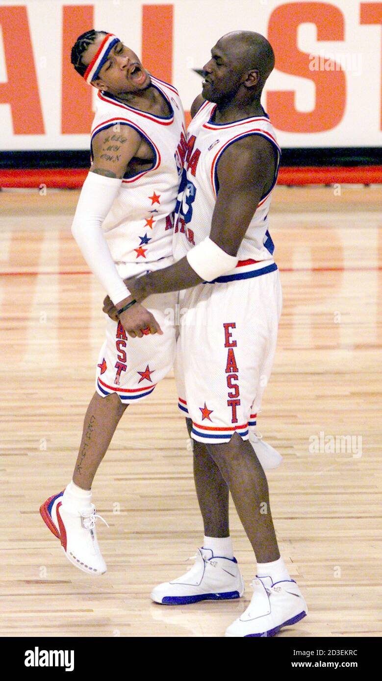 NBA All-Star East Squad teammates Allen Iverson (L), of the Philadelphia  76ers, celebrates with the Washington Wizards Michael Jordan during the  52nd annual NBA All-Star game played in Atlanta, February 9, 2003.