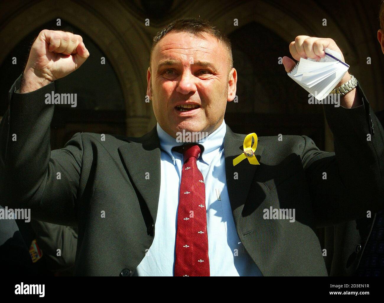 British Gulf War veteran, former Parachute Regiment medical officer Shaun Rusling, celebrates after the High Court upheld a ruling that he is entitled to a pension because he is suffering from a syndrome linked to his service in the 1991 Gulf War, in London, June 13, 2003. The ruling may make it easier for other veterans who say their health has been wrecked to claim damages, although the judge made it clear that the ruling does not mean official recognition of the generic concept of Gulf War Syndrome and that subsequent cases would be considered on their individual merits. REUTERS/Peter Macdi Stock Photo
