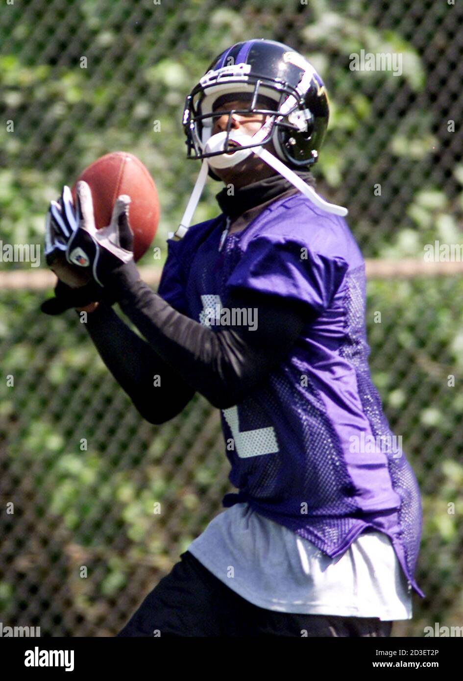 Newest member of the Baltimore Ravens, Deion Sanders catches a pass on the  field at the teams' practice facility in Owings Mills, Maryland September  1, 2004. Sanders was signed to a one