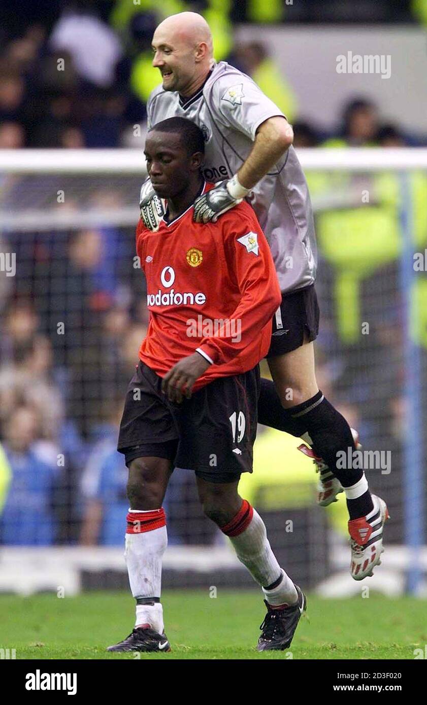 Manchester United S French Goal Keeper Fabien Barthez Jumps On The Back Of Dwight Yorke After Beating Manchester City At Maine Road Novemebr 18 00 Manchester United Won The Match 1 0 Ih Stock Photo Alamy