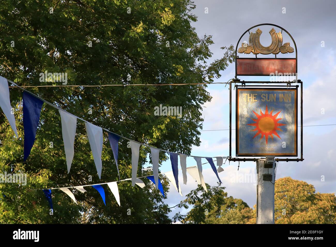 The Sun Inn sign, Dunsfold, Surrey, UK Stock Photo