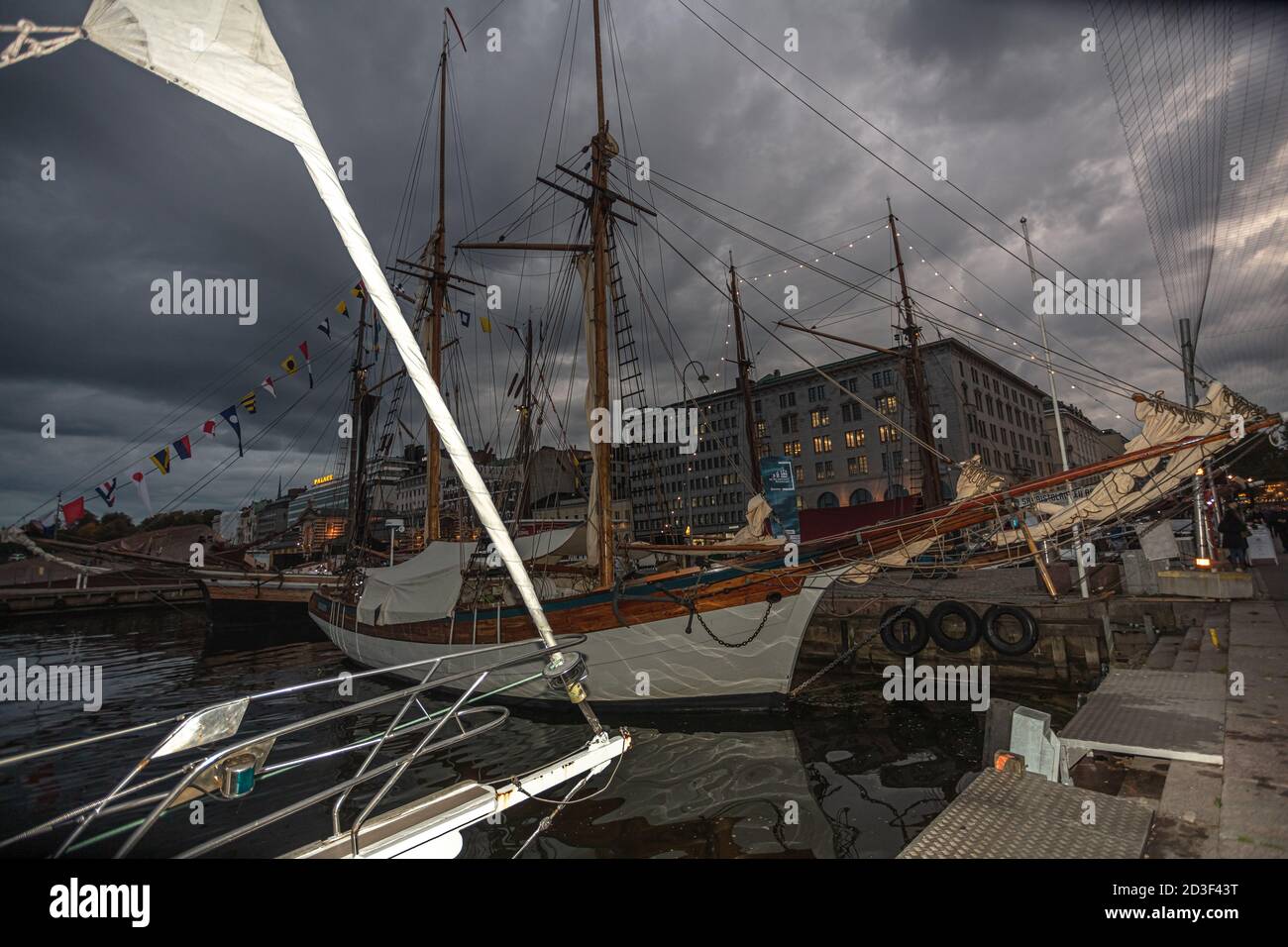Helsinki, Uusimaa, Finland October 7, 2020 Moored boats and yachts at the Market Square to take part in the traditional delicatessen fair. Evening time. High quality photo Stock Photo
