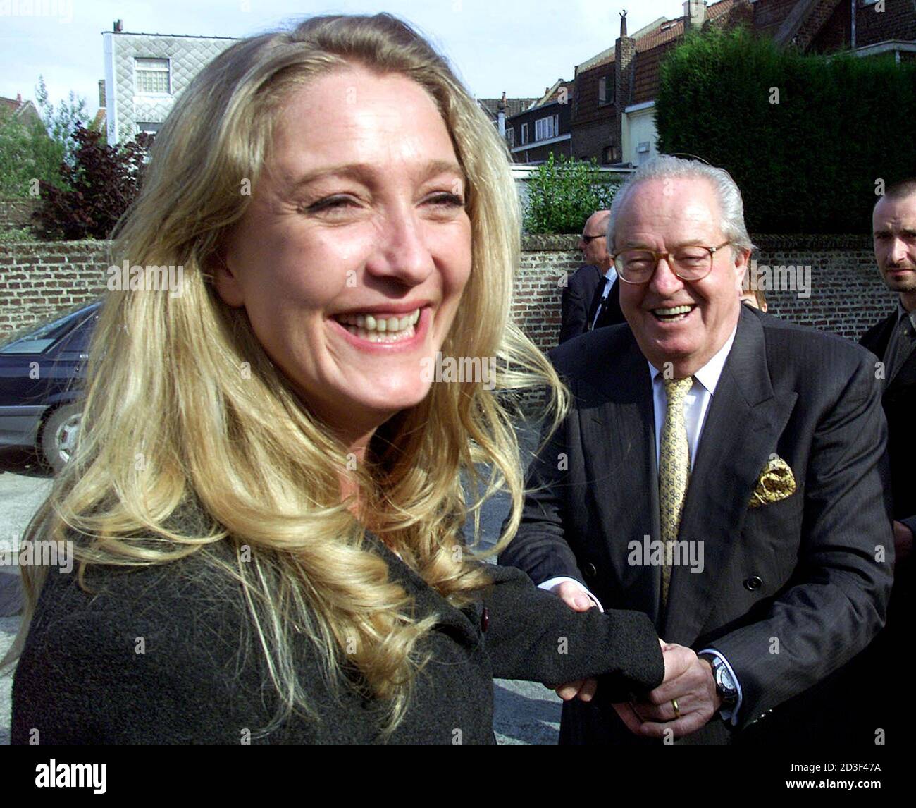 French National Front leader Jean Marie Le Pen (R) says goodbye to his  daughter Marine after a conference in Lomme, Northern France May 30, 2002. Marine  Le Pen is candidate in the