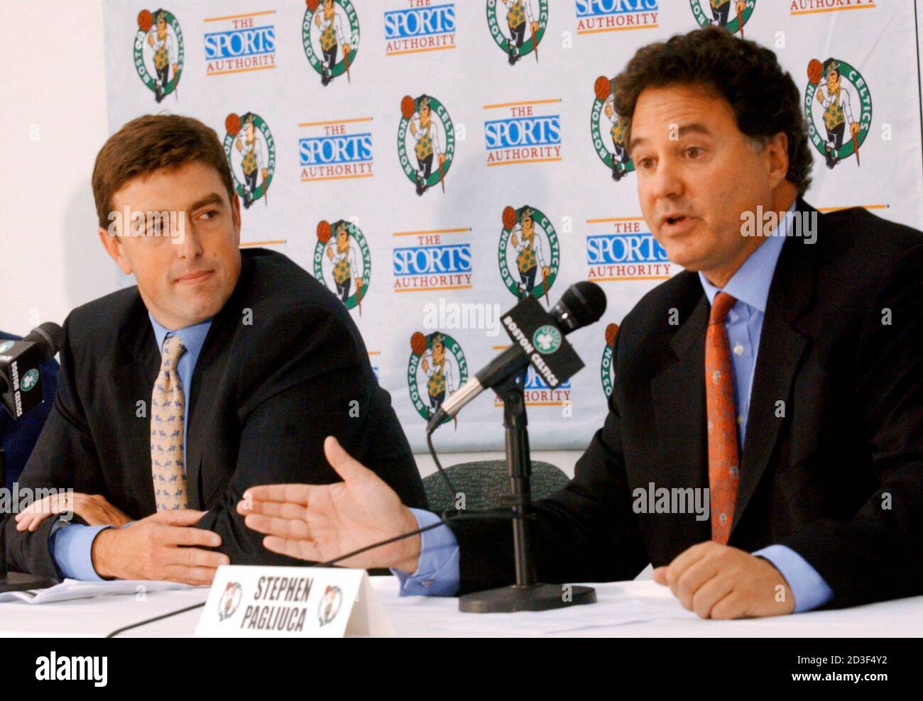 Representatives of the private investment group Boston Basketball Partners,  Wycliffe Grousbeck (L), a general partner at Highland Capital Partners, and  Stephen Pagliuca (R), a managing director at Bain Capital, announce to  reporters