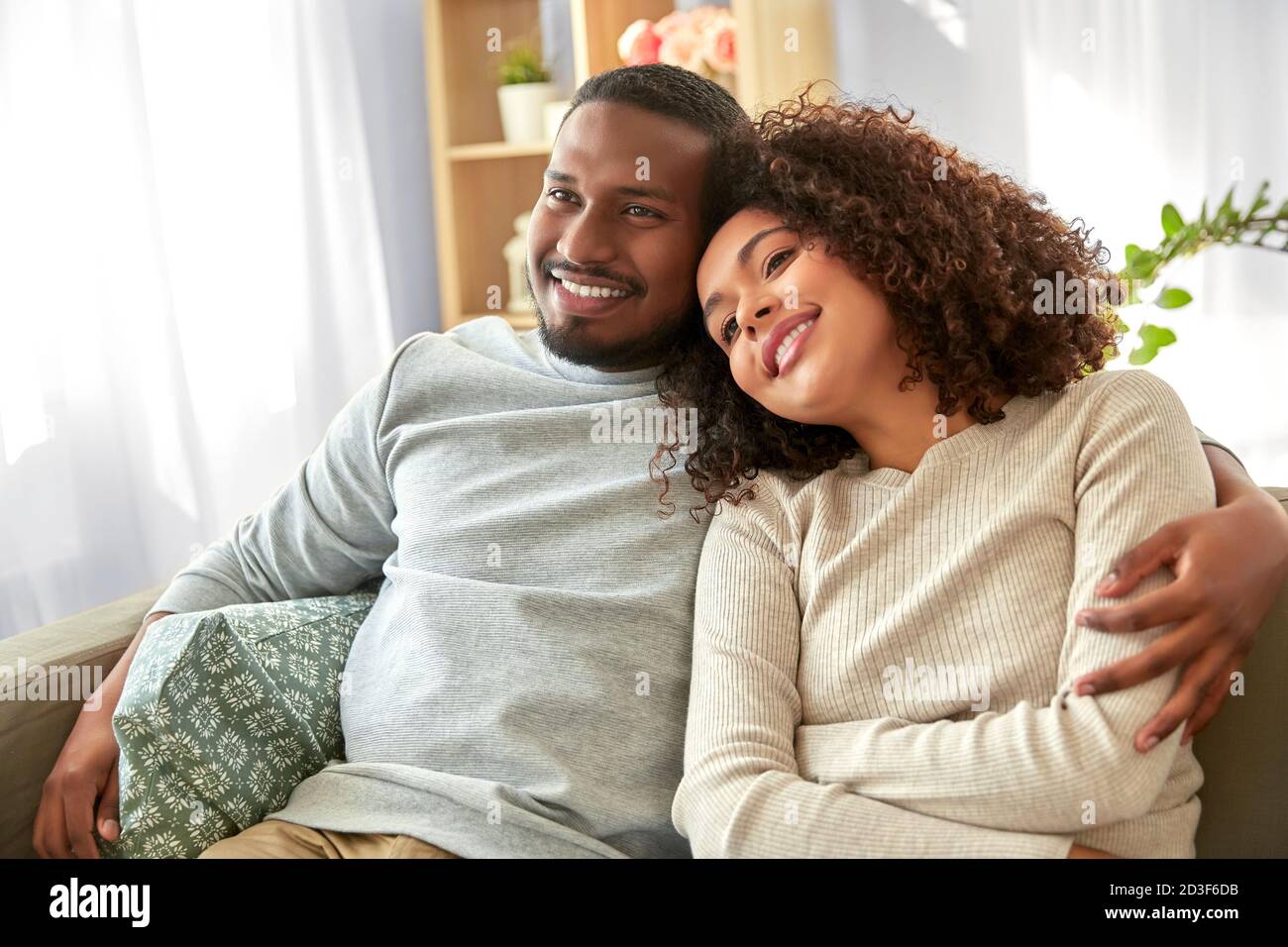 happy african american couple hugging at home Stock Photo - Alamy