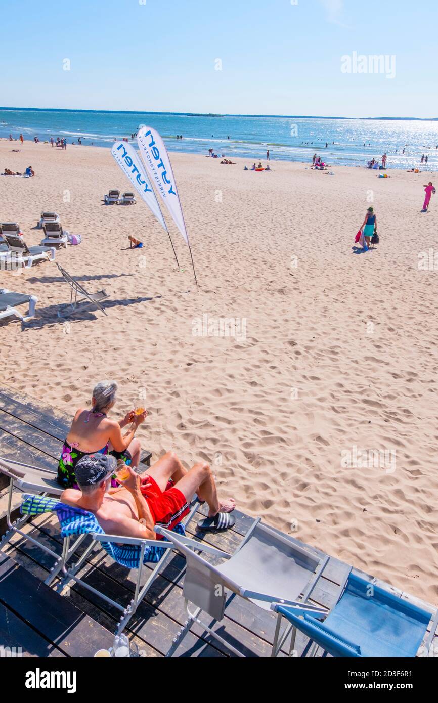 People relaxing on lounge chairs, Rantaravintola Helmi, Yyteri, Pori, Finland Stock Photo