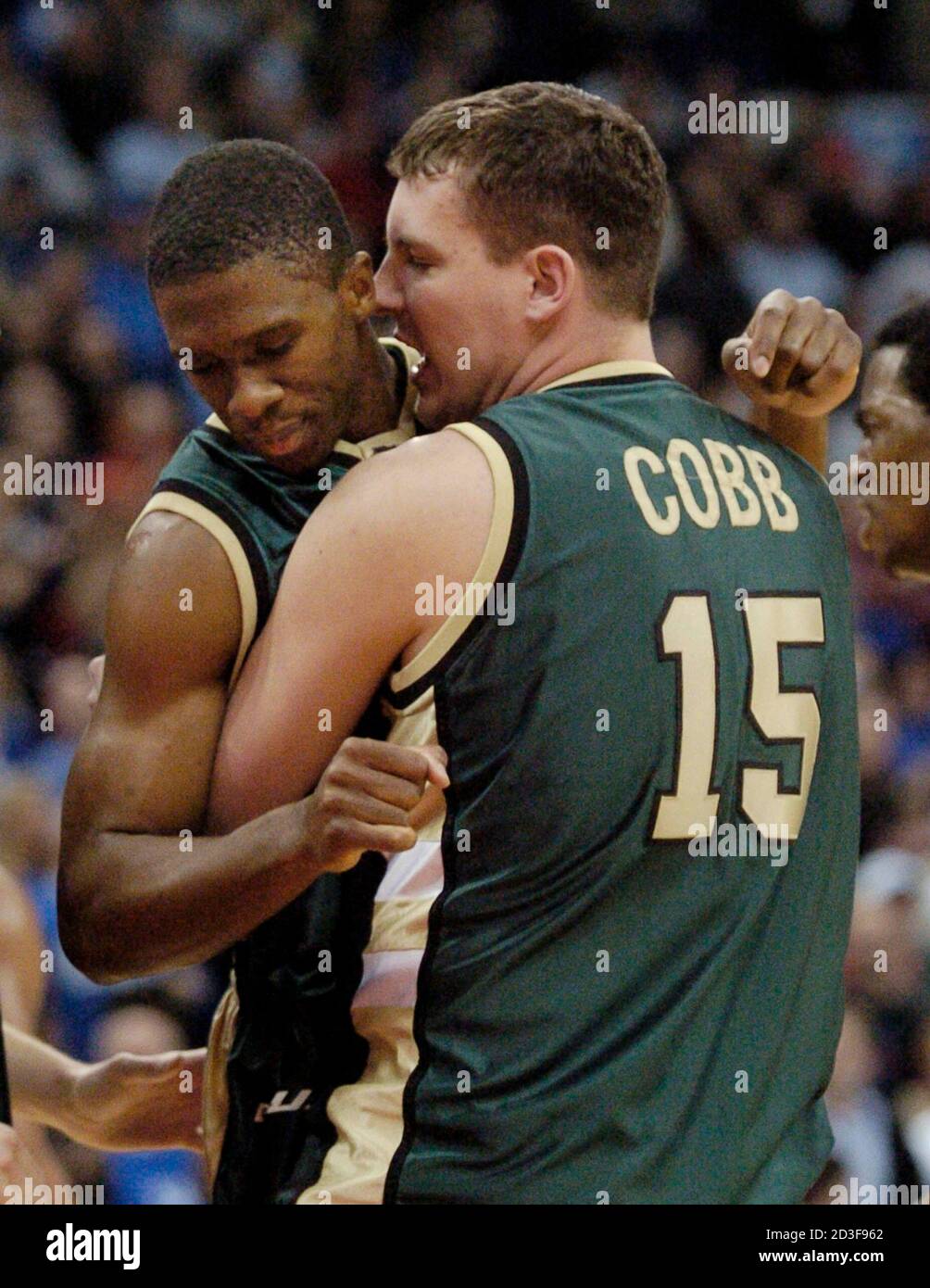 University of Alabama at Birmingham's Mo Finley (L) is hugged by teammate  Lee Cobb (R) after Finley hit the winning basket with 12 second left to  give them a 76-75 upset win