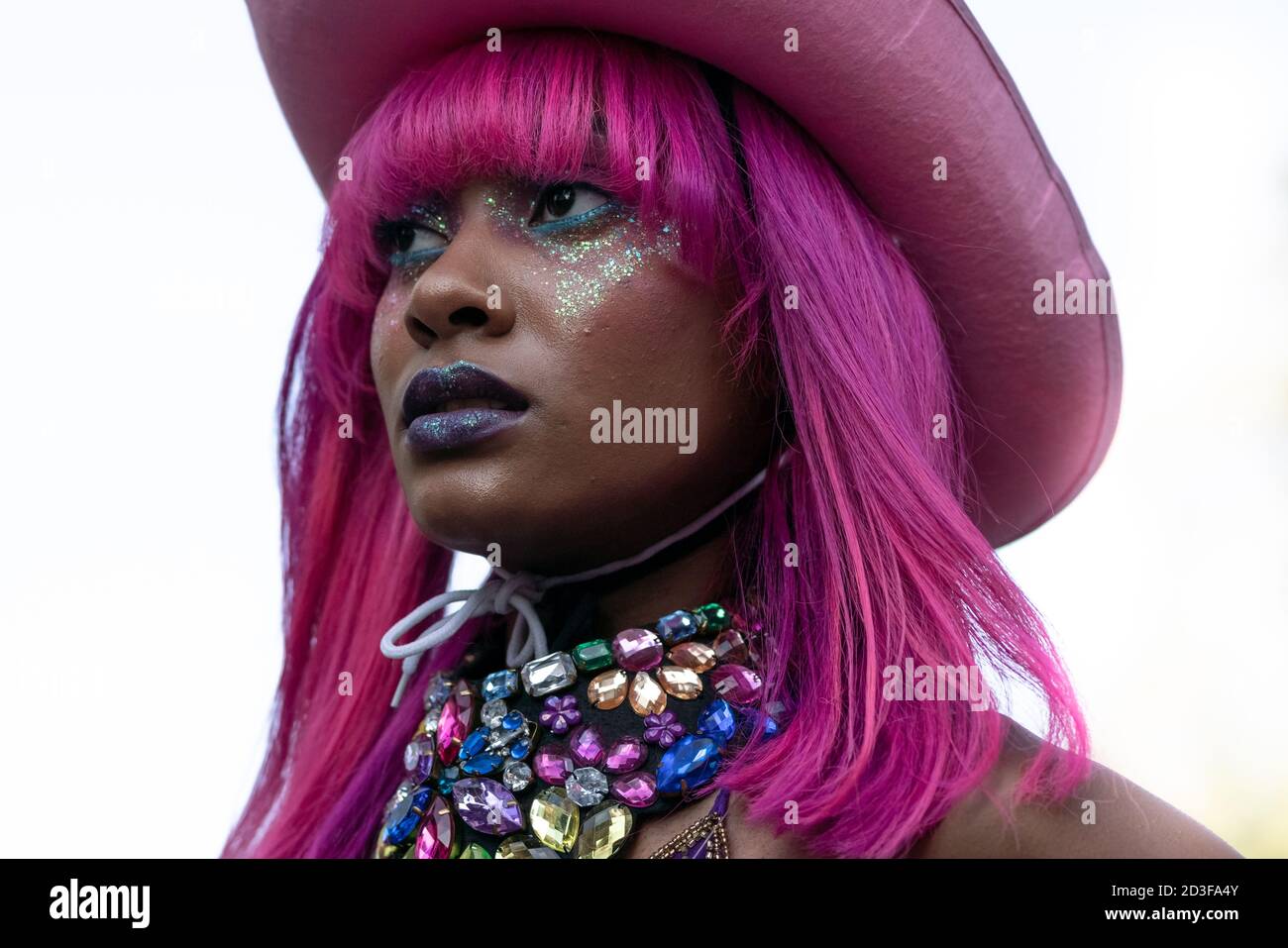 Models take part in a colourful flashmob street fashion show in Leicester Square for designer Pierre Garroudi. London, UK. Stock Photo