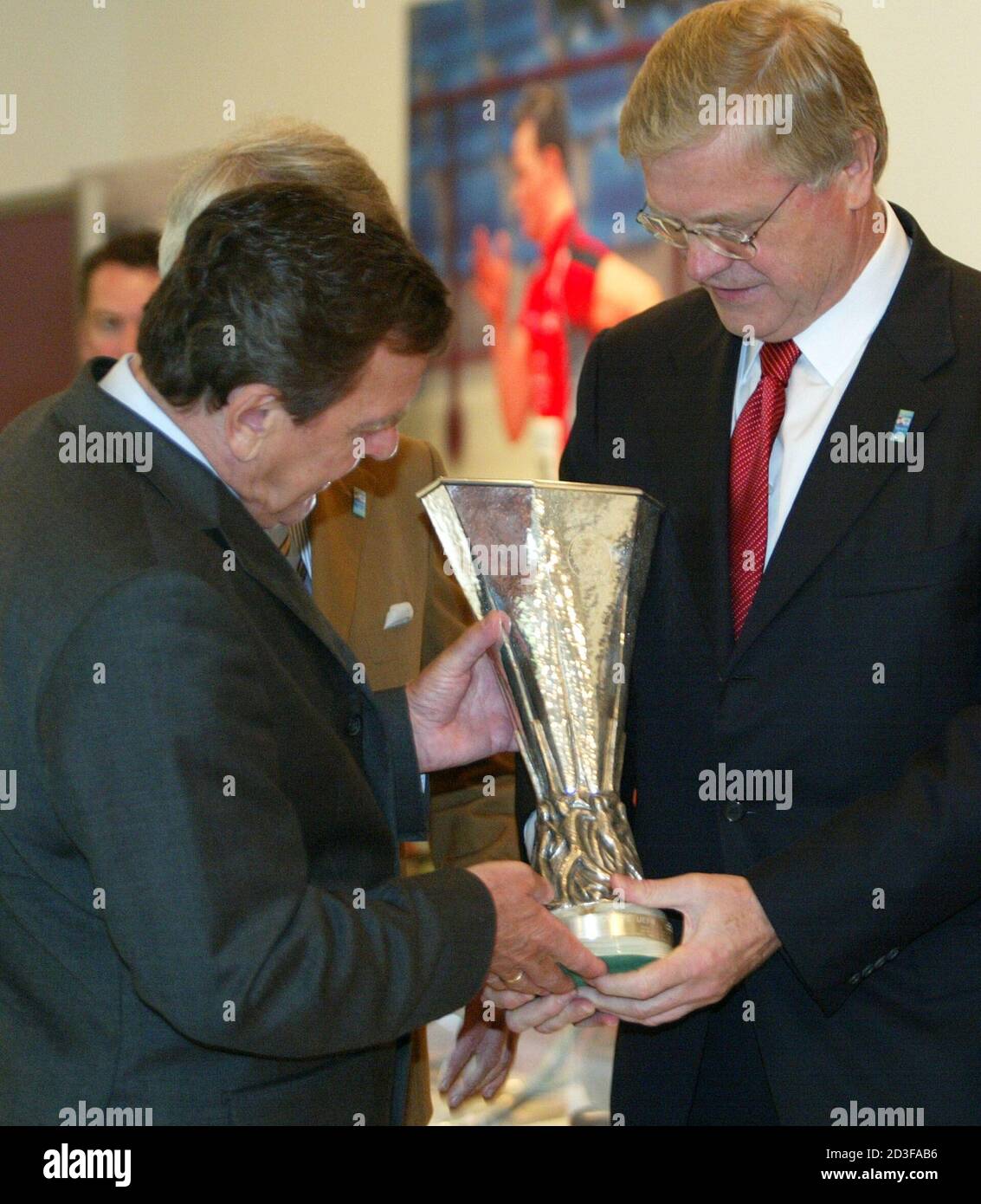 Werner Wenning R Ceo Of Bayer Ag Shows A Mock Up Of The Uefa Cup To German Chancellor Gerhard Schroeder During A Celebration Of The 100 Year Birthday Of Tsv Bayer 04 Leverkusen In