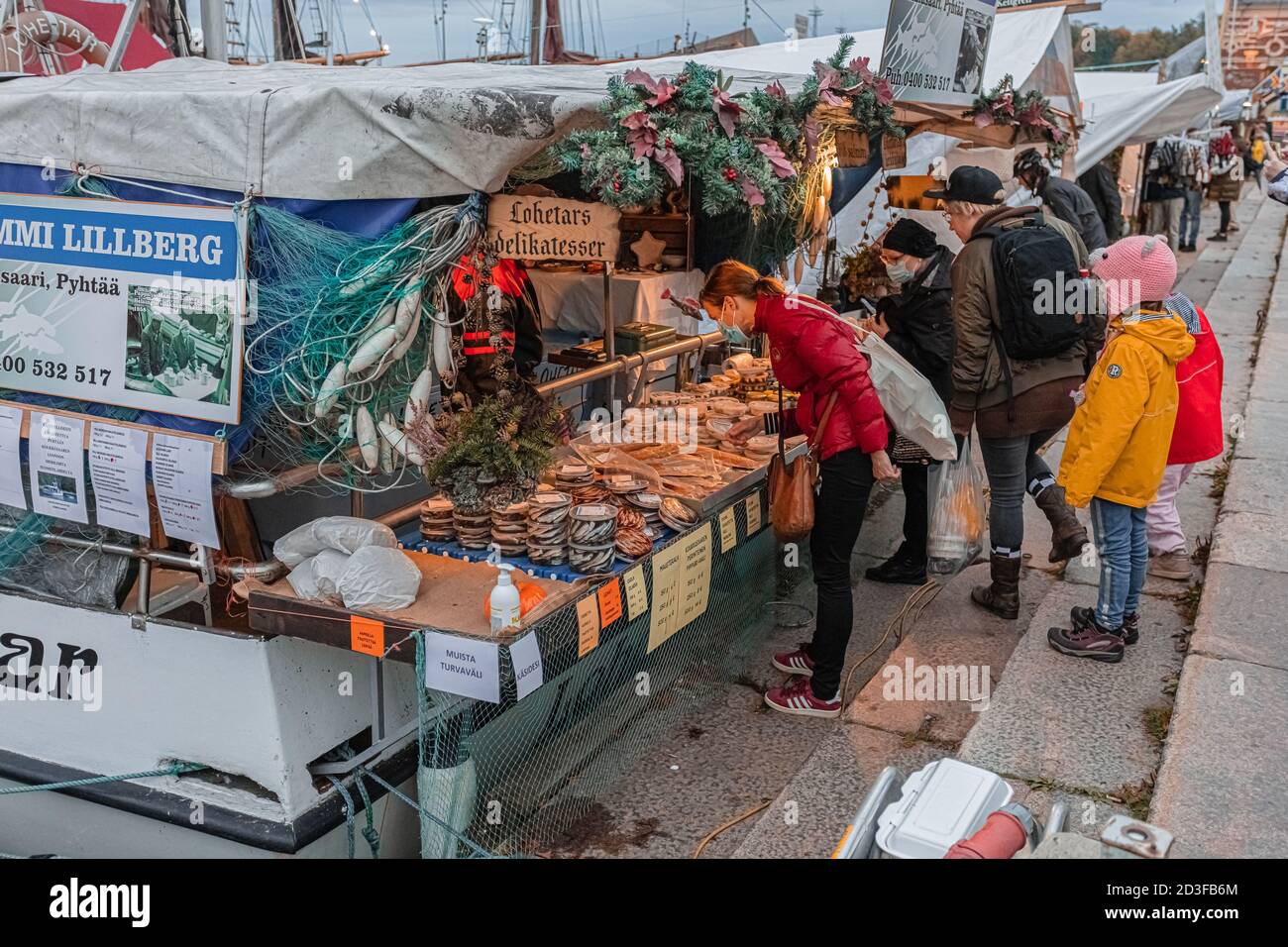Helsinki, Uusimaa, Finland October 7, 2020 Market square, autumn, traditional fair. People buy fish delicacies. High quality photo Stock Photo