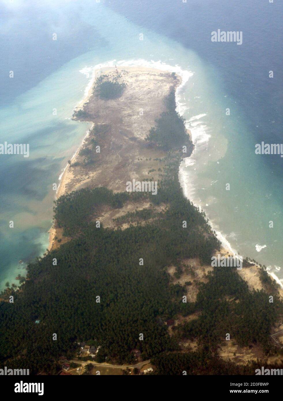 An aerial view of the eroded shore line at Hut Bay on the Little Andaman island in India's tsunami hit remote Andaman and Nicobar archipelago, January 2, 2005. India raised the number of people killed or feared killed in last week's tsunami to 14,488 on Sunday, up by more than 1,700 since the previous evening's estimate. REUTERS/Altaf Hussain  AH/GB Stock Photo