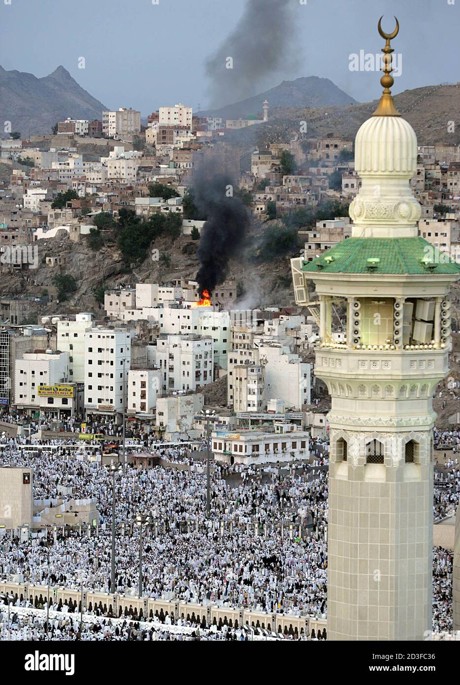 Smoke Billows For A Building Near The Grand Mosque Before The Evening Prayer In Mecca January 17 05 About Two Million Muslim Pilgrims Gathered For Their Haj Pilgrimage This Year The Haj