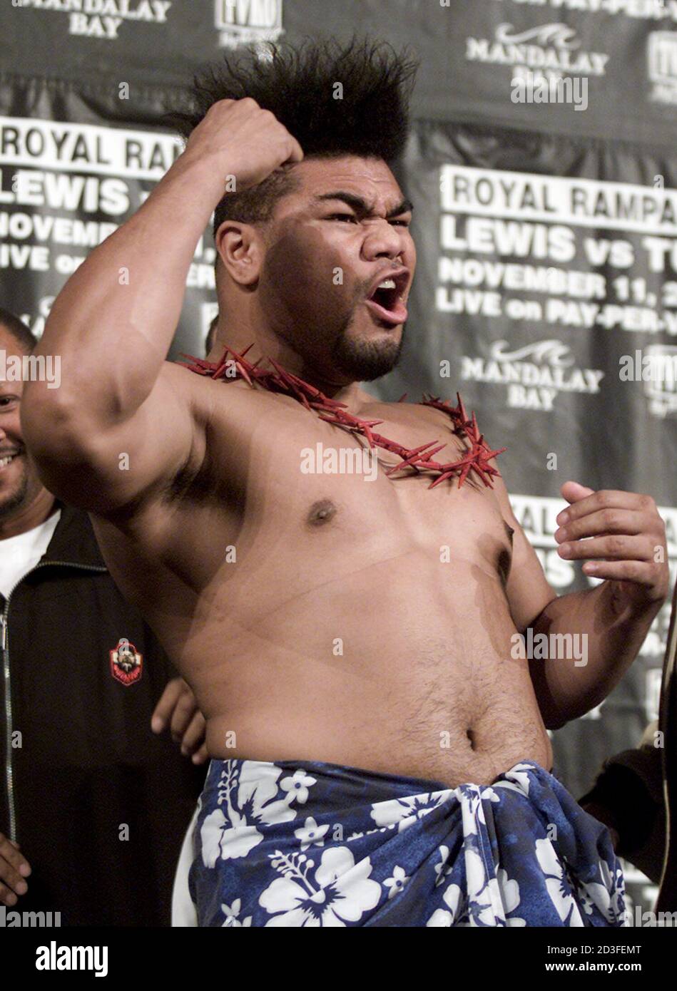 Samoan boxer David Tua, of New Zealand, throws a punch after weighing
