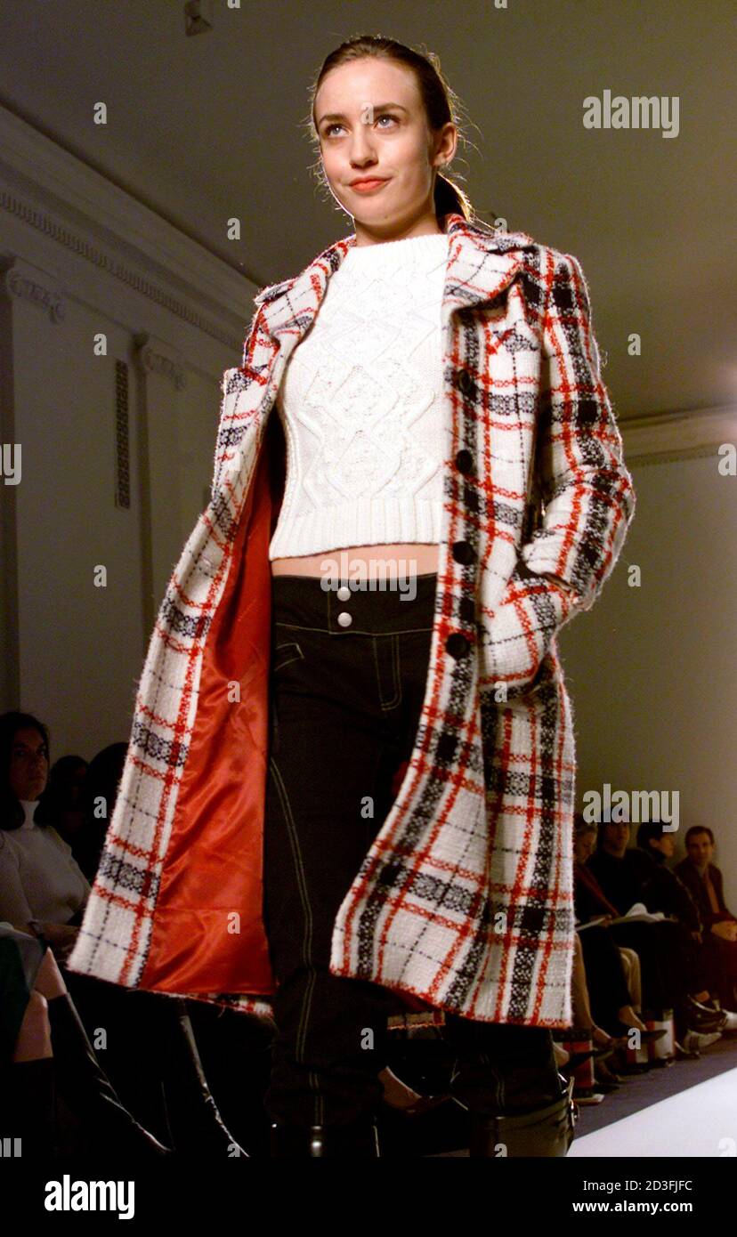 Model Elizabeth Jagger, the daughter of rocker Mick Jagger and model Jerry  Hall, wears a red white and blue plaid wool boucle coat, bone cotton  sweater and navy denim biker pants for
