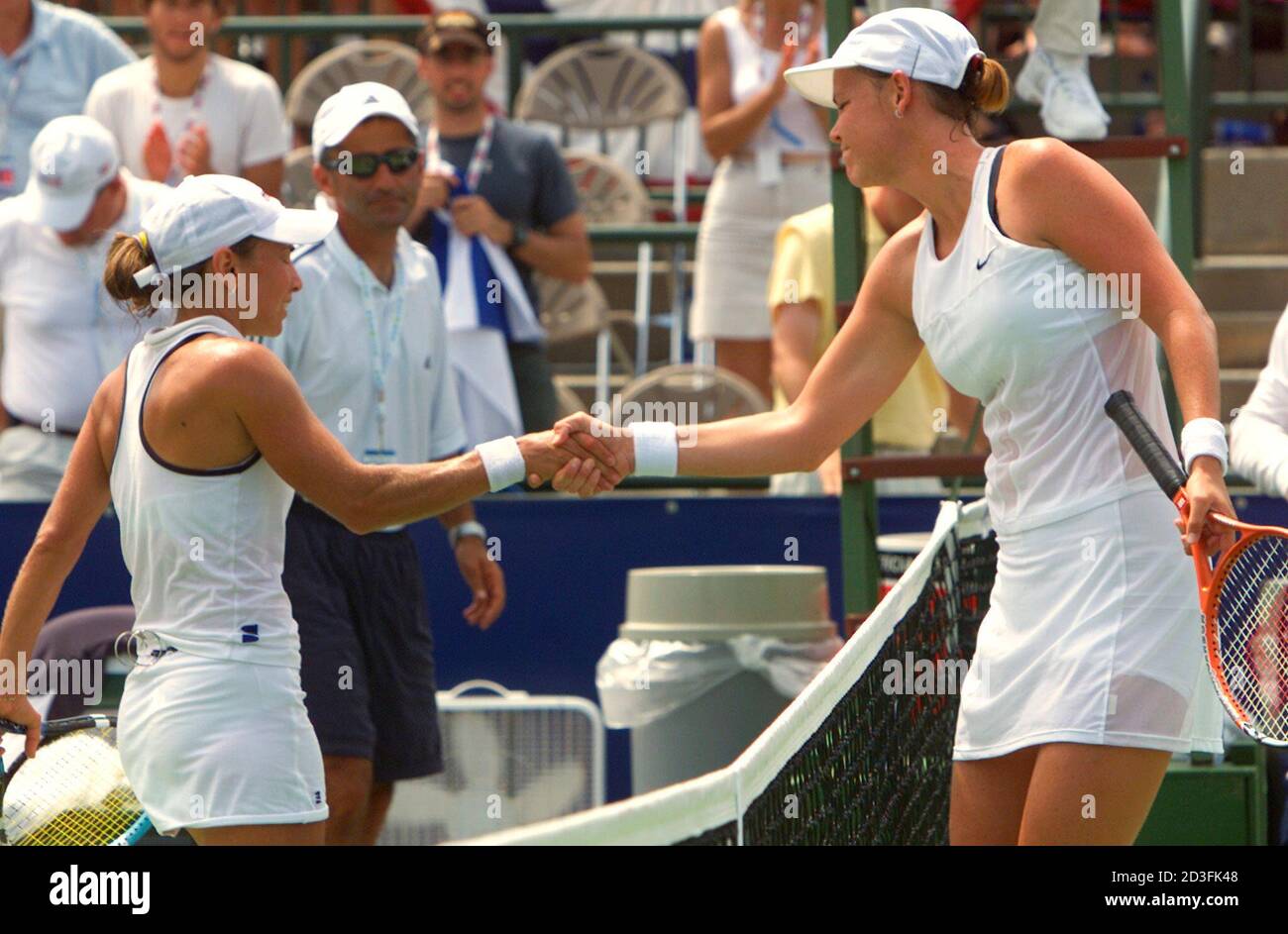 Lindsay Davenport (R) of the United States shakes hands with Anna Smashnova  of Israel following their match in a Fed Cup World Group Playoff in  Springfield, Missouri, July 20, 2002. Davenport, making
