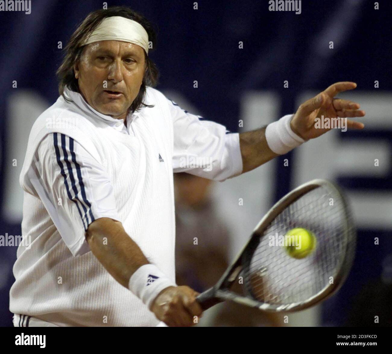 ILIE NASTASE OF ROMANIA RETURNS THE BALL TO STAN SMITH OF U.S. DURING  REMAKE OF DAVIS CUP FINAL IN BUCHAREST Stock Photo - Alamy