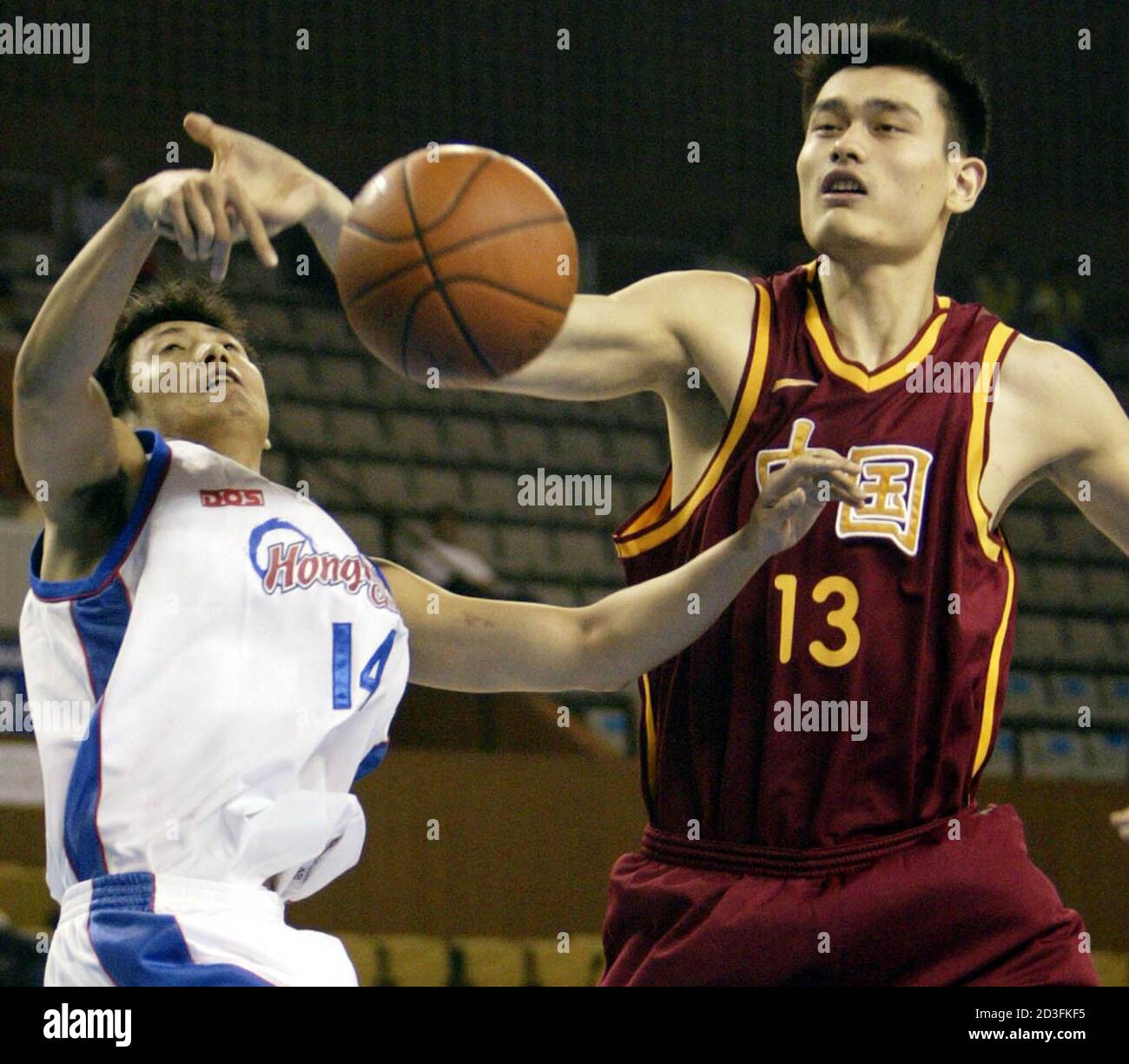 Yao Ming R Of China And Yu Hing Hoi Of Hong Kong Battle For The Ball During The Preliminary Round A Group Match Of Men S Basketball At The 14th Asian Games In Yao Ming R Of China And Yu Hing Hoi Of Hong Kong Battle For The Ball During The Preliminary Round A Group Match Of Men S Basketball At The 14th Asian Games In