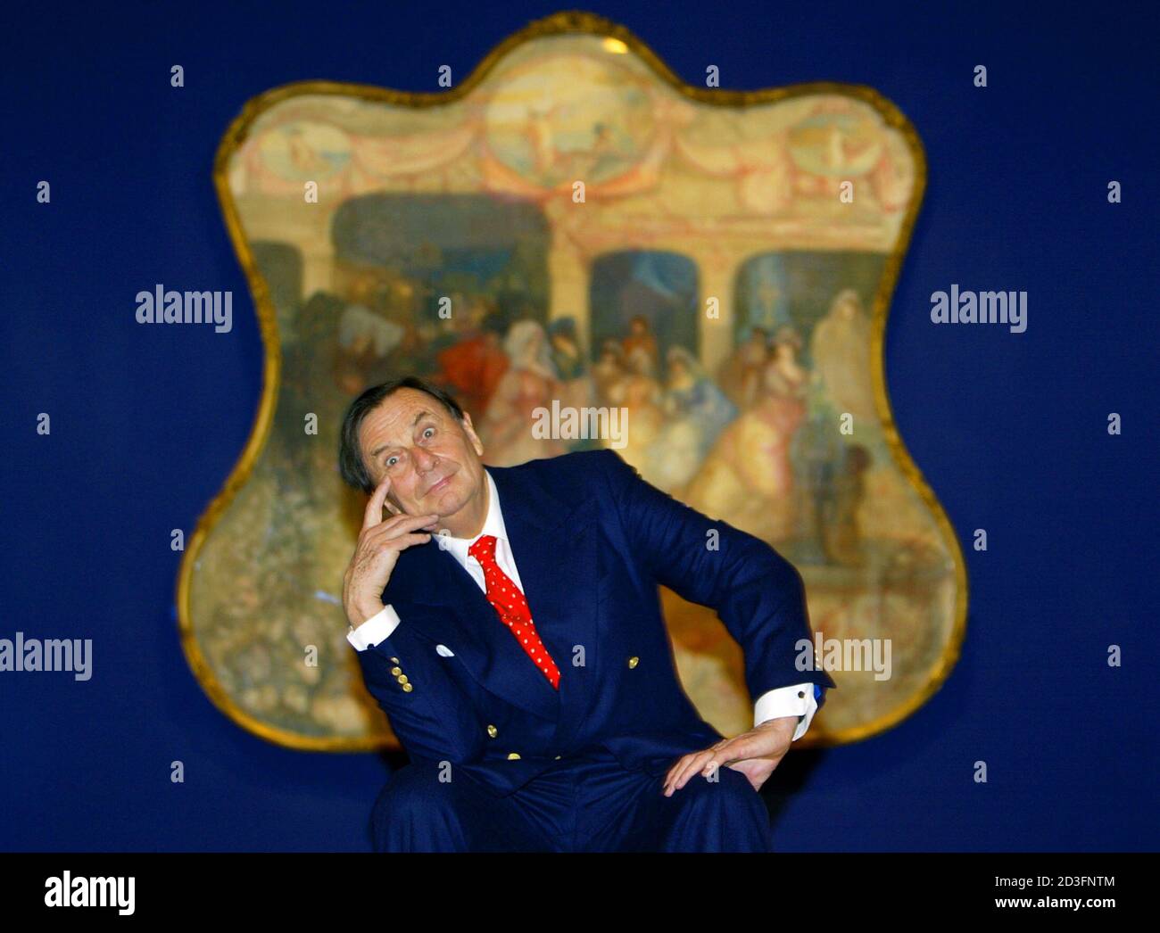 QUALITY REPEAT Australian comedian Barry Humphries poses in front of one of Australian artist Charles Condor's paintings at the launch of his retrospective at the New South Wales Art Gallery in Sydney June 12, 2003. Humphries, who owns alot of the works in the show, officially opened the exhibition which inlcudes 112 paintings of the world-renowned artist's watercolours, drawings and prints. REUTERS/David Gray  DG/CP Stock Photo