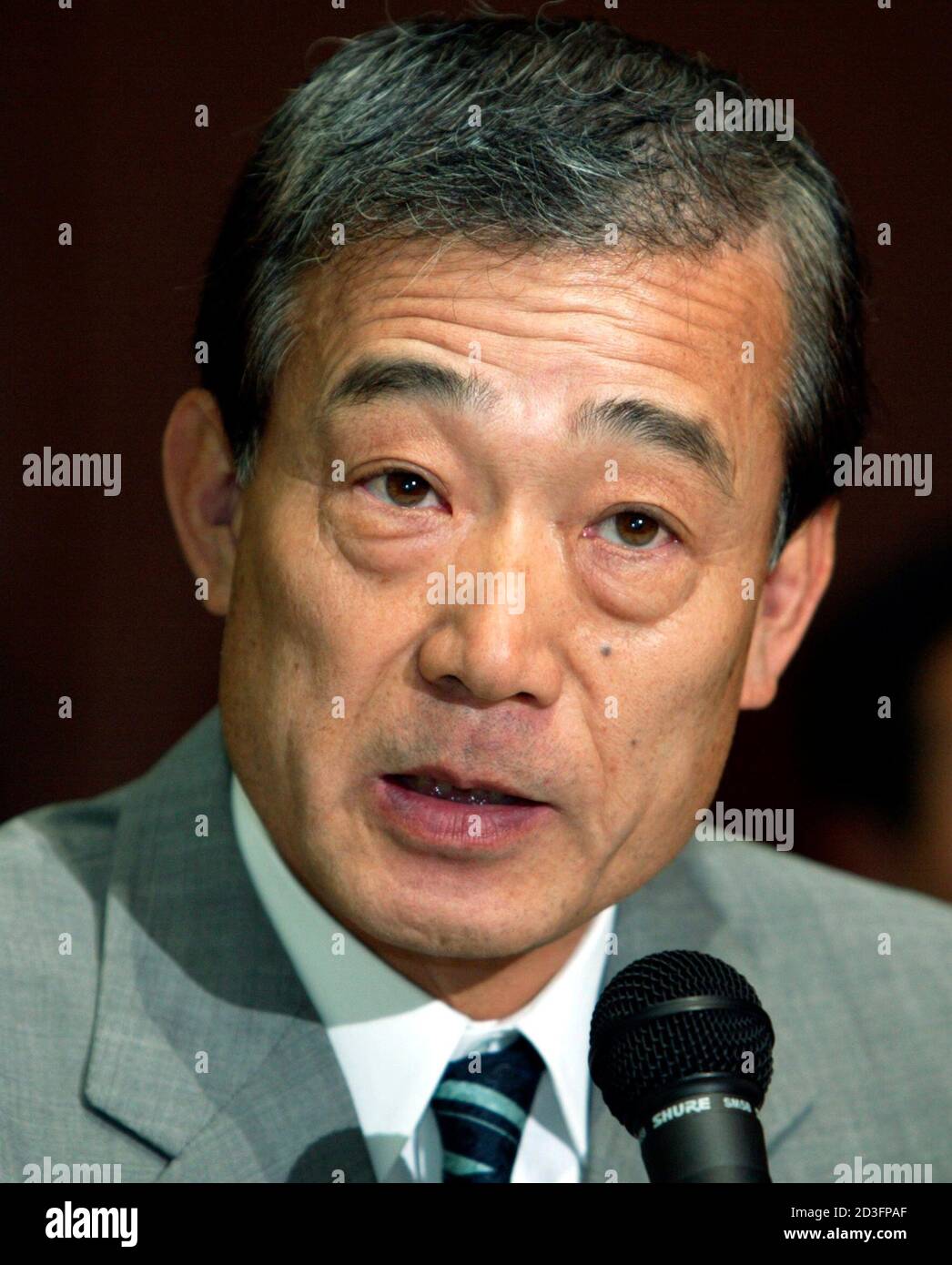 Honda Motor President and CEO Takeo Fukui speaks to reporters at an