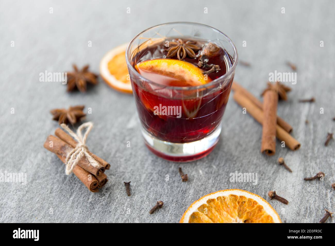 hot mulled wine, orange slices, raisins and spices Stock Photo