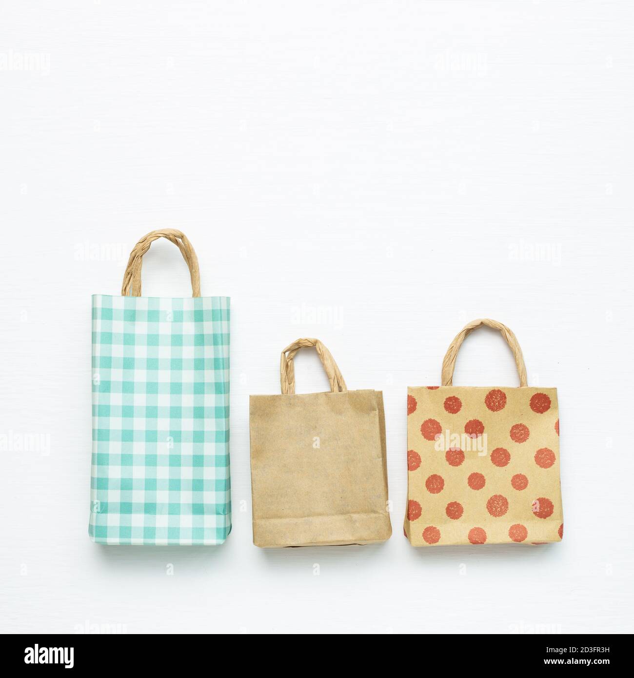 Paper shopping bags on white background. top view, copy space Stock Photo