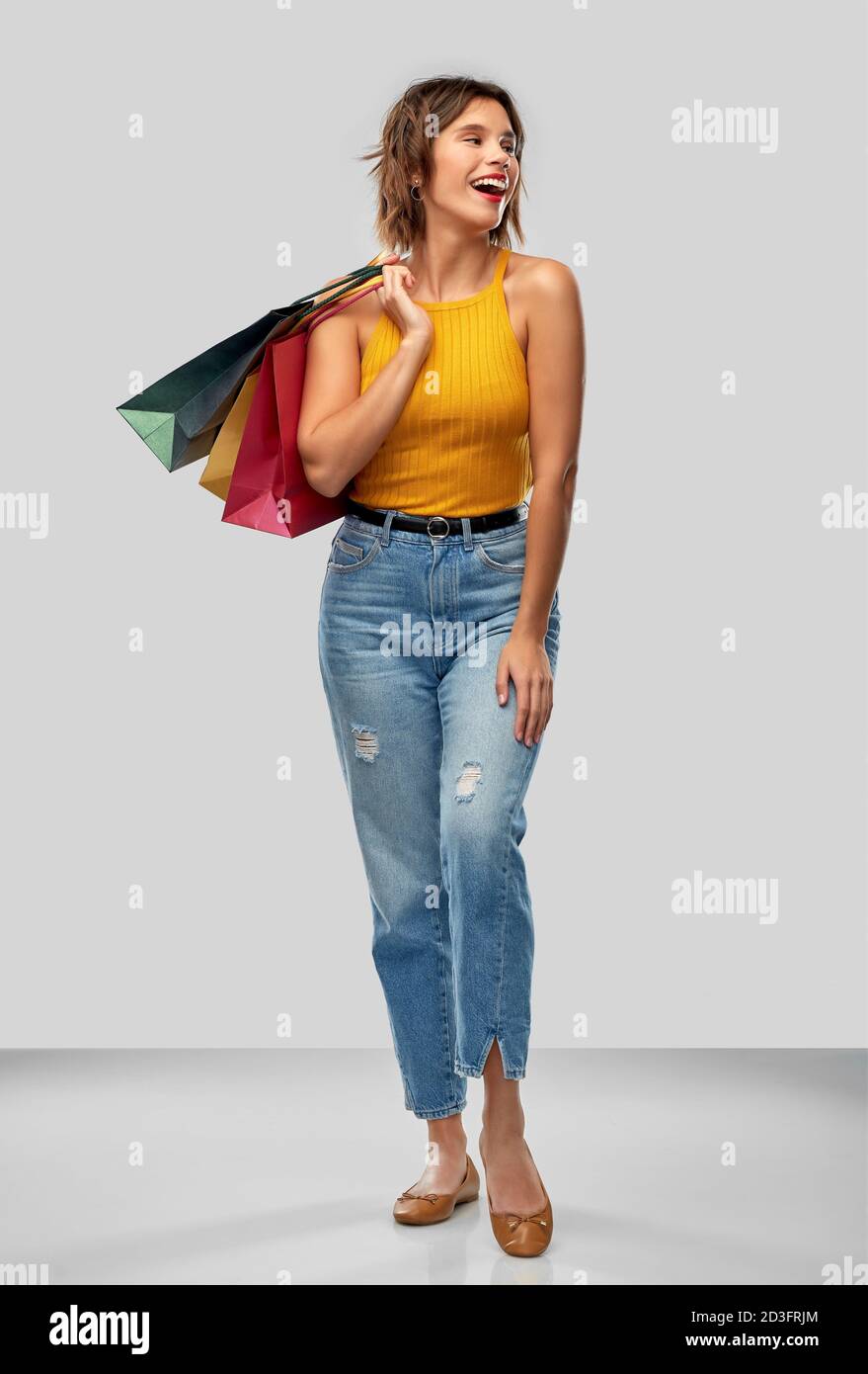 happy smiling young woman with shopping bags Stock Photo - Alamy
