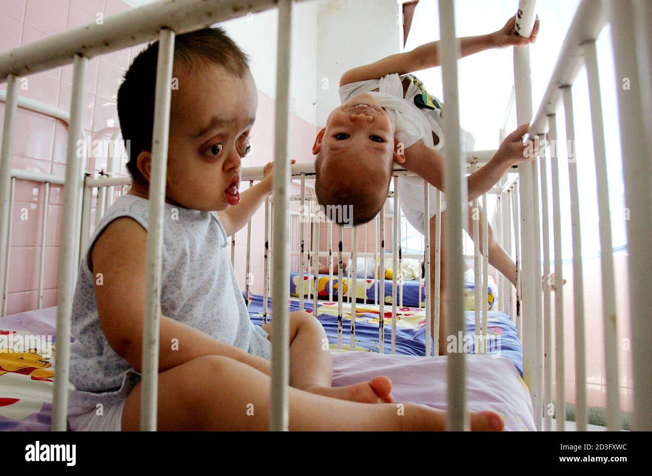 Young Vietnamese Disabled Victims Of Agent Orange Play In Their Cots In A Ho Chi Minh City Hospital February 25 05 On Monday A New York Court Will Begin Hearing A Lawsuit