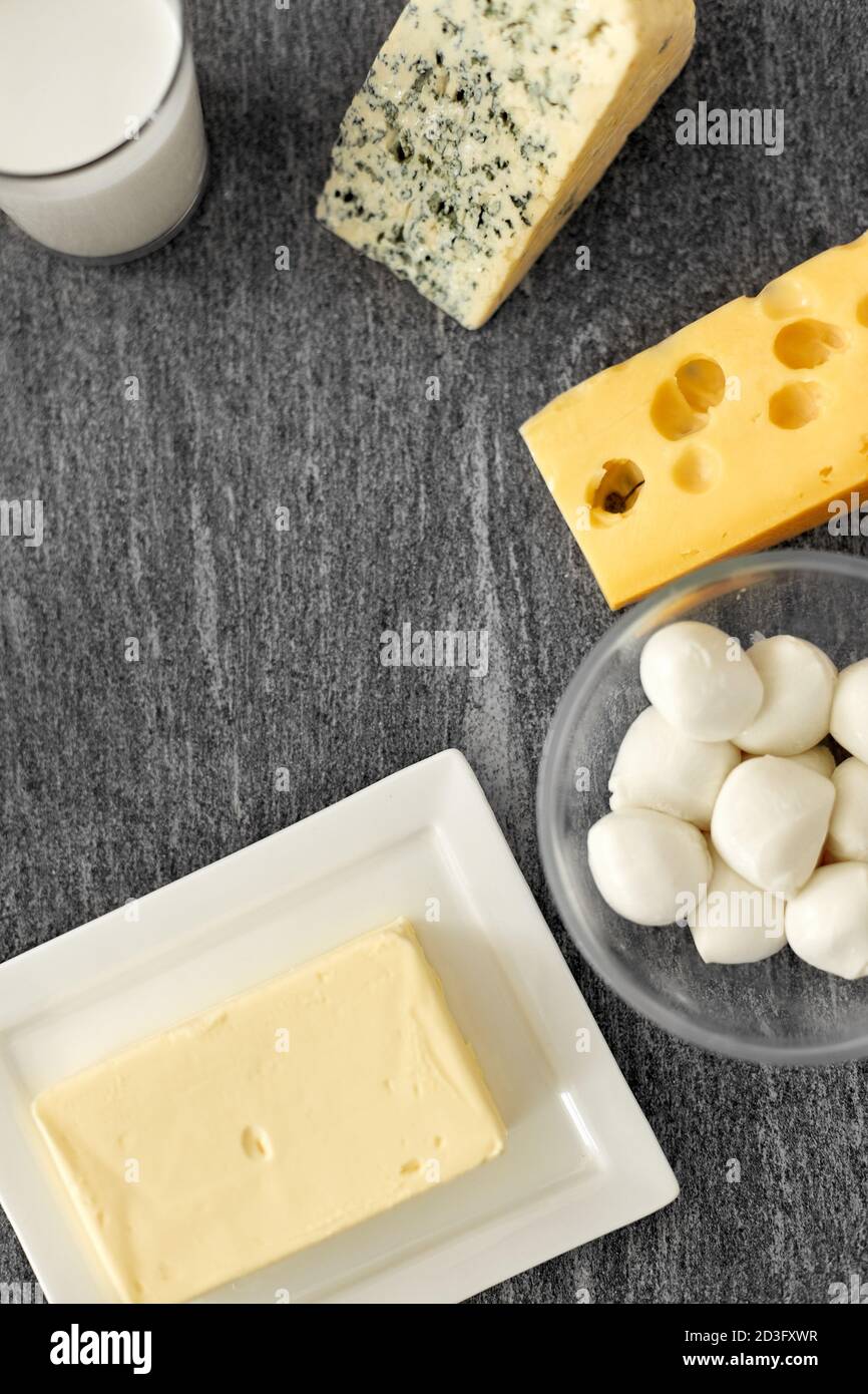 different kinds of cheese, milk glass and butter Stock Photo