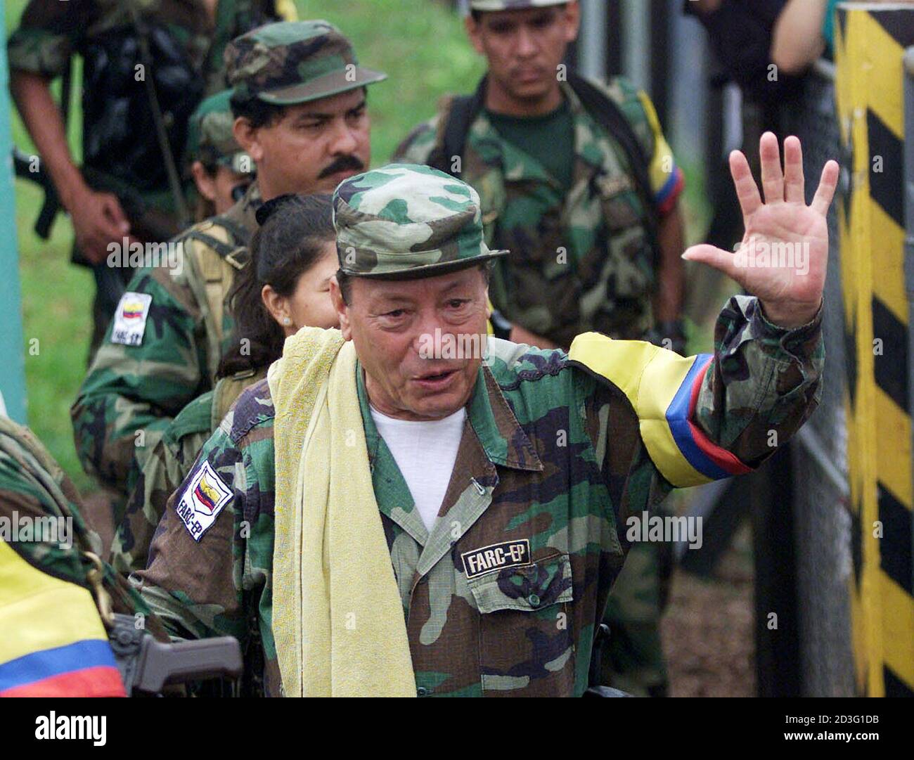 FARC rebel commander Manuel Marulanda known as "Sureshot" greets supporters  as he arrives for a peace meeting in Los Pozos, Caqueta province, March 8,  2001. With the absence of the United States,