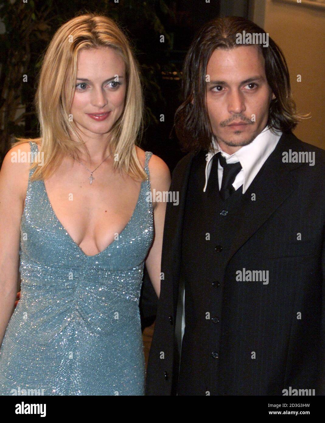 Actress Heather Graham and actor Johnny Depp, stars of the new film "From  Hell" pose at the film's premiere in Los Angeles October 17, 2001. The film  about the infamous killer Jack