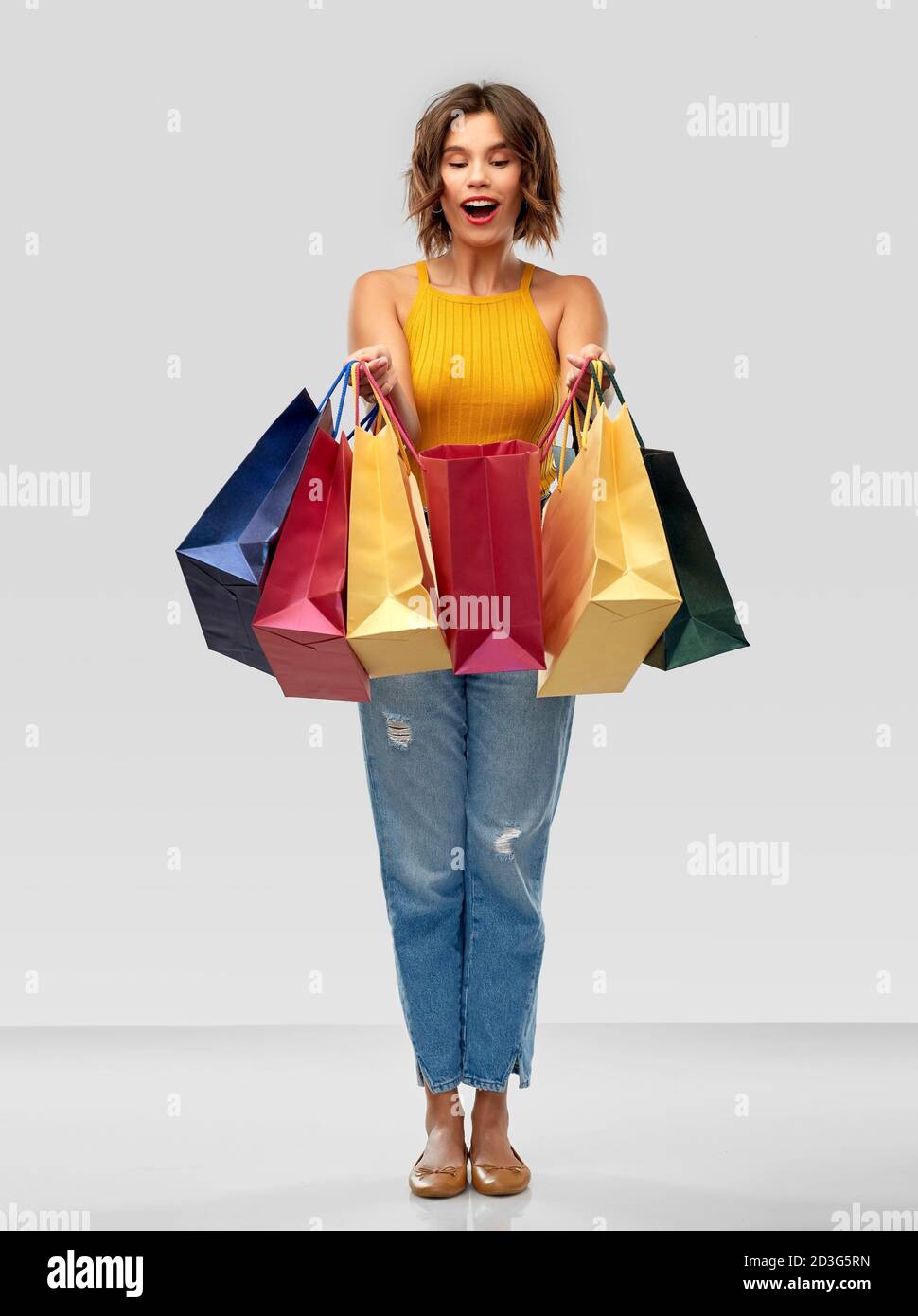 happy smiling young woman with shopping bags Stock Photo