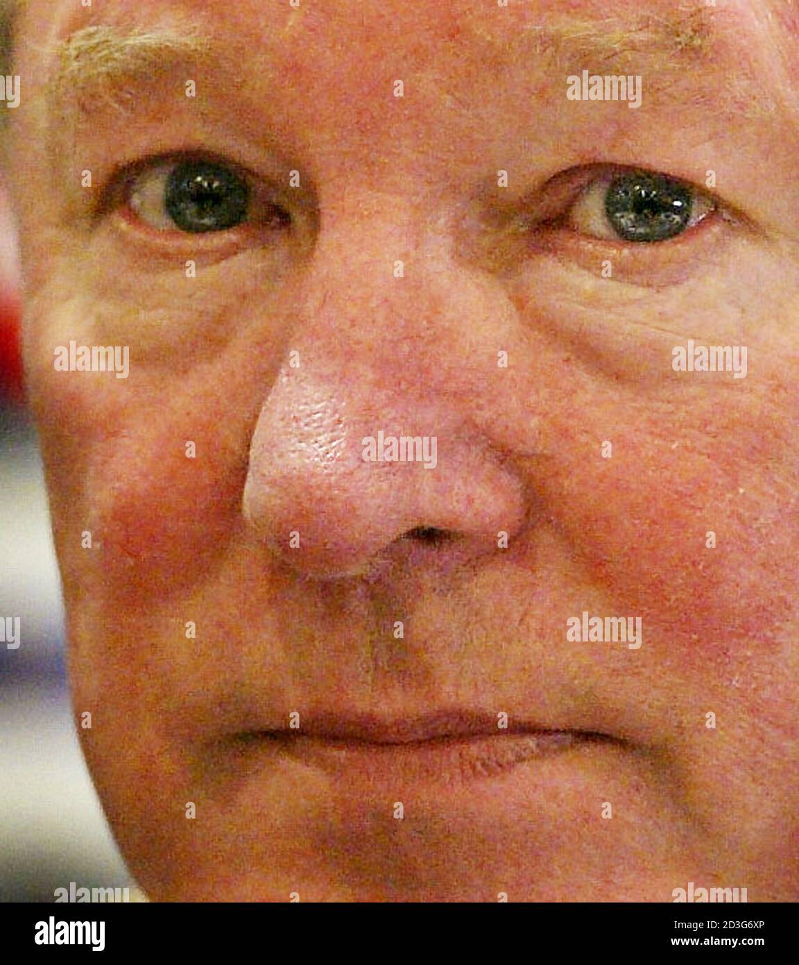 Manchester United manager Sir Alex Ferguson talks to the media at a news  conference at Old Trafford, Manchester, February 18, 2003. Ferguson  admitted on February 17 injuring Manchester United midfielder and England