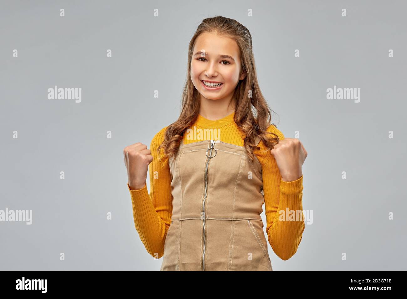 happy young teenage girl celebrating success Stock Photo - Alamy