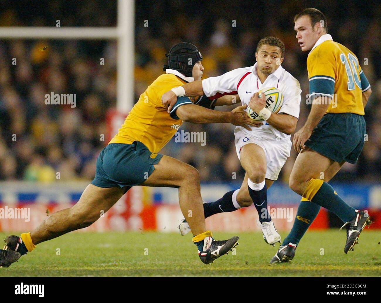 England S Mike Tindall Is Tackled By Australia S Steve Kefu L As Nathan Grey Looks On During The Rugby Union Test Match At Dockland Stadium In Melbourne June 21 2003 England Defeated Australia