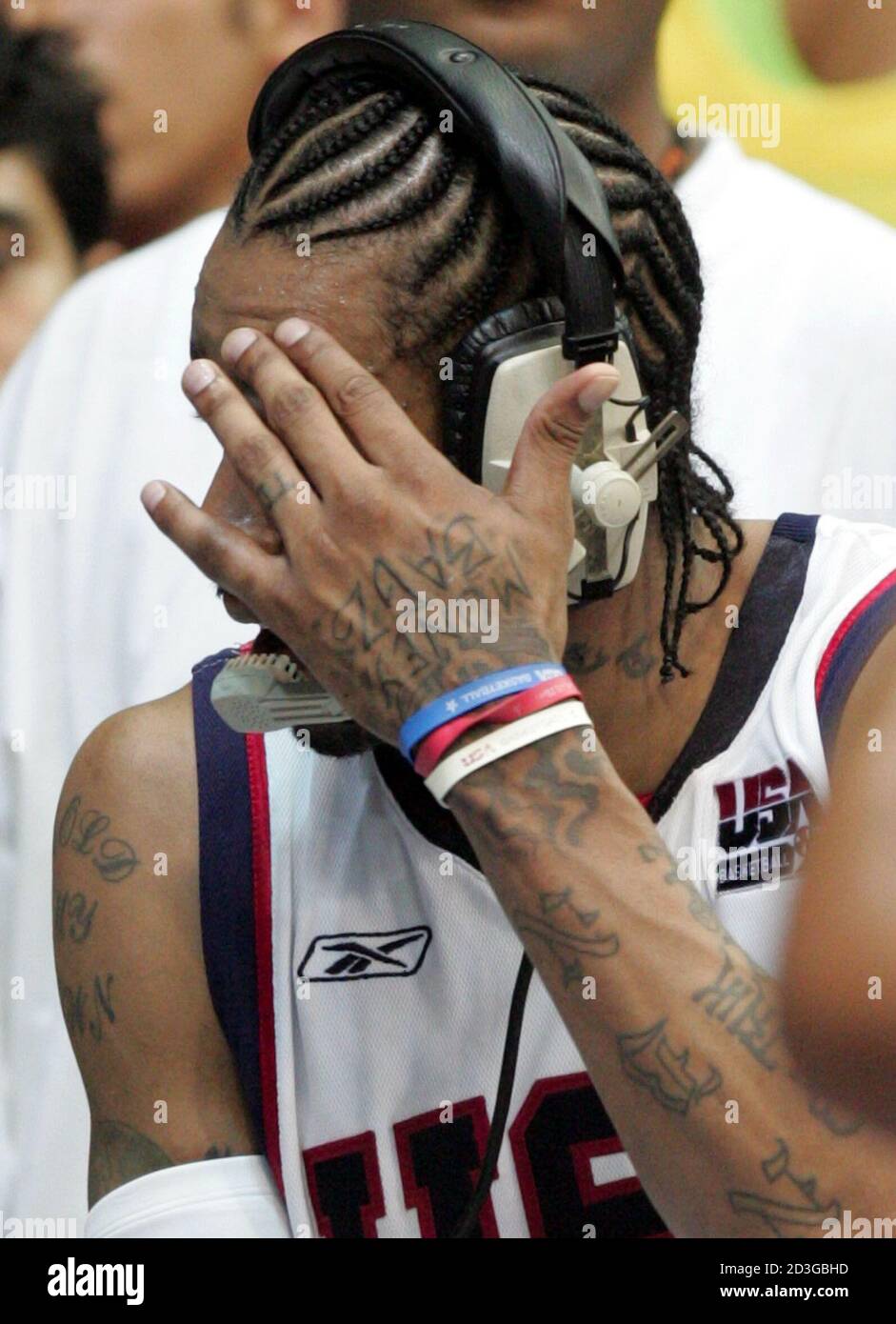 USA Olympic team guard Allen Iverson of Philadelphia 76'ers covers his face  during a TV interview in Istanbul. USA Olympic team guard Allen Iverson of  Philadelphia 76'ers whose shoulders and arms covered