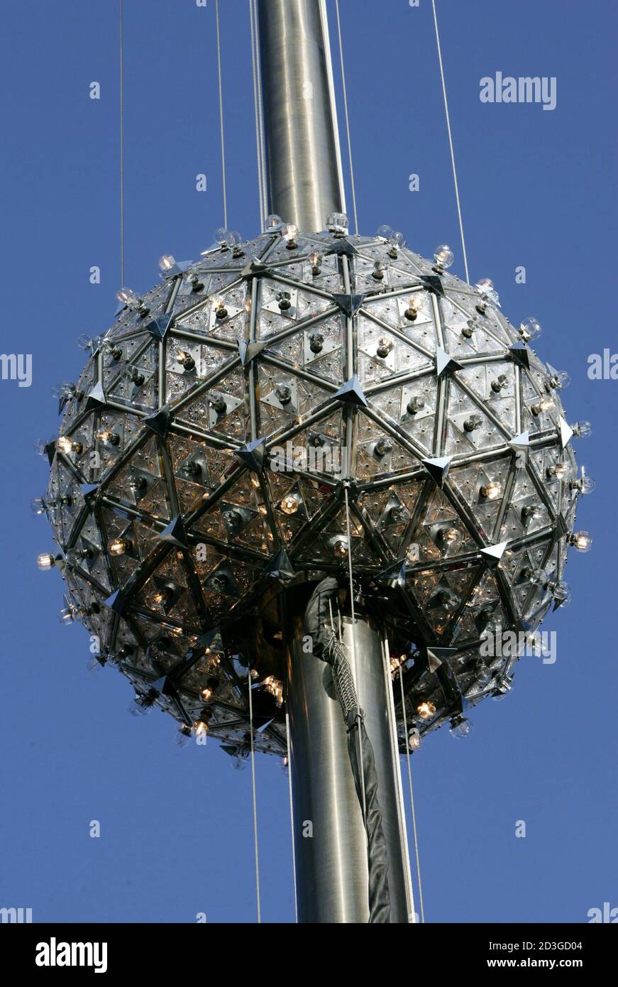 The Waterford Crystal Times Square ball is raised above 1 Times Square in  New York City, December 30, 2004, during a test for the annual New Year's  Eve midnight drop of the