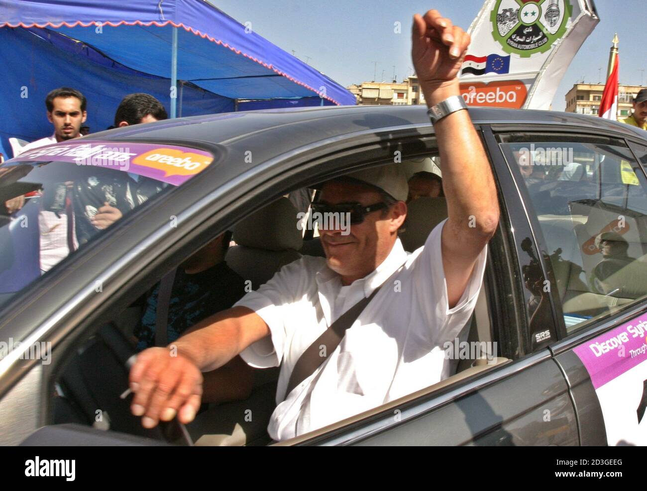 Egyptian Arab actor Farouq al-Fishawi gestures at the start of the Discover Syria Rally in Damascus May 11, 2005. Forty five participants from the EU, Saudi Arabia, Jordan, Lebanon, Egypt, and Syria took part in the rally taking them around Syrian forests, mountains and deserts in a 900 km (559 miles) trip to discover historical sites. REUTERS/ Khaled al-Hariri  kh/SA Stock Photo