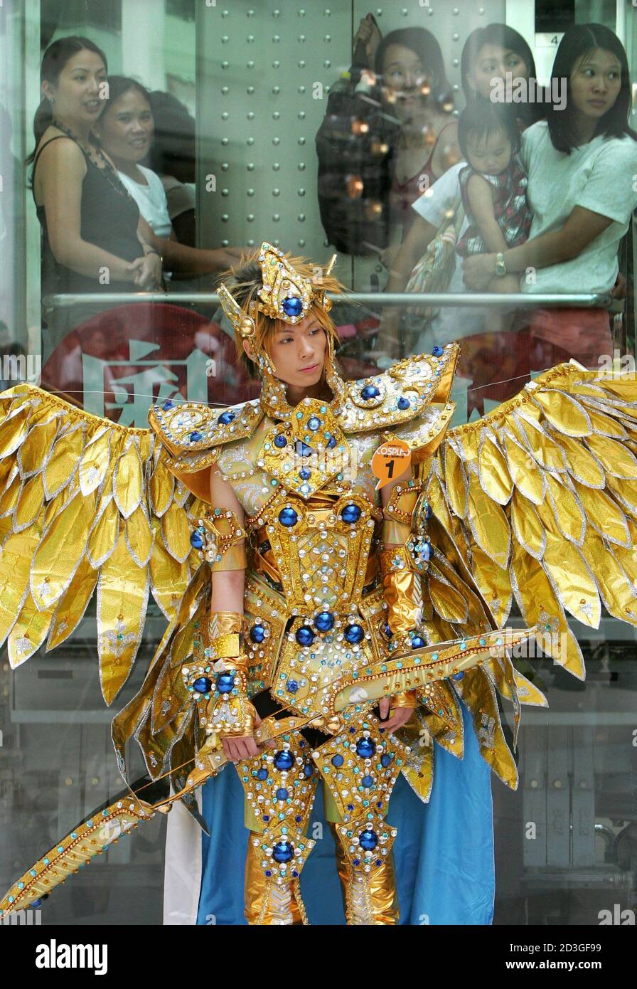 A cosplayer dressed as a character from the Japanese cartoon "Saint Seiya"  stands in front of onlookers during a cosplay contest at a shopping mall in  Hong Kong July 19, 2005. The
