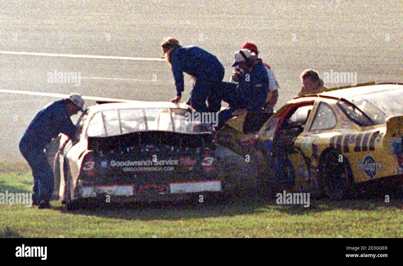 Rescue workers arrive at Dale Earnhardt's Goodwrench Chevrolet in turn