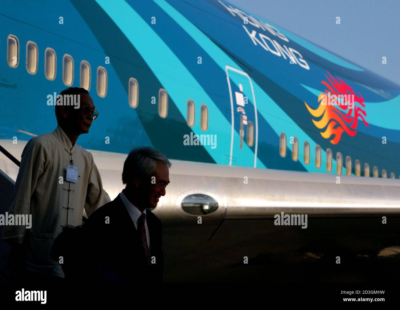 Guests Walk Down The Stairs From A Newly Painted Hong Kong Asia S World City Boeing 747 400 Aircraft After An Unveiling Ceremony At The Hong Kong Airport July 4 02 Cathay Pacific Airways