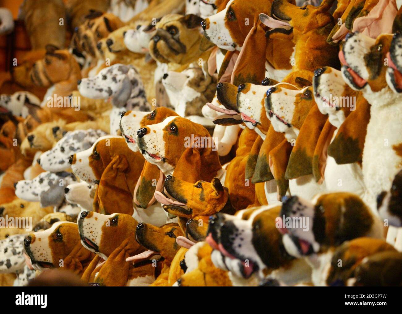 Stuffed toy dogs stand on display at the Crufts dog show in Birmingham, March 6, 2003. The 100th Crufts show, which was founded in 1891 by entrepreneur Charles Cruft, is expected to attract more than 170 breeds of dog who will compete for this year's best-in-show title, awarded on the competition's final day on Sunday. REUTERS/Peter Macdiarmid  PKM/MD/CRB Stock Photo