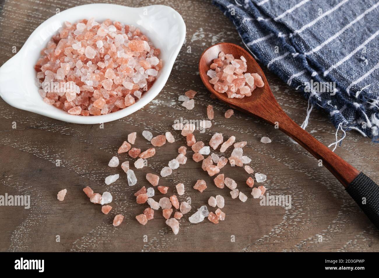 Pink himalayan salt on rustic background Stock Photo
