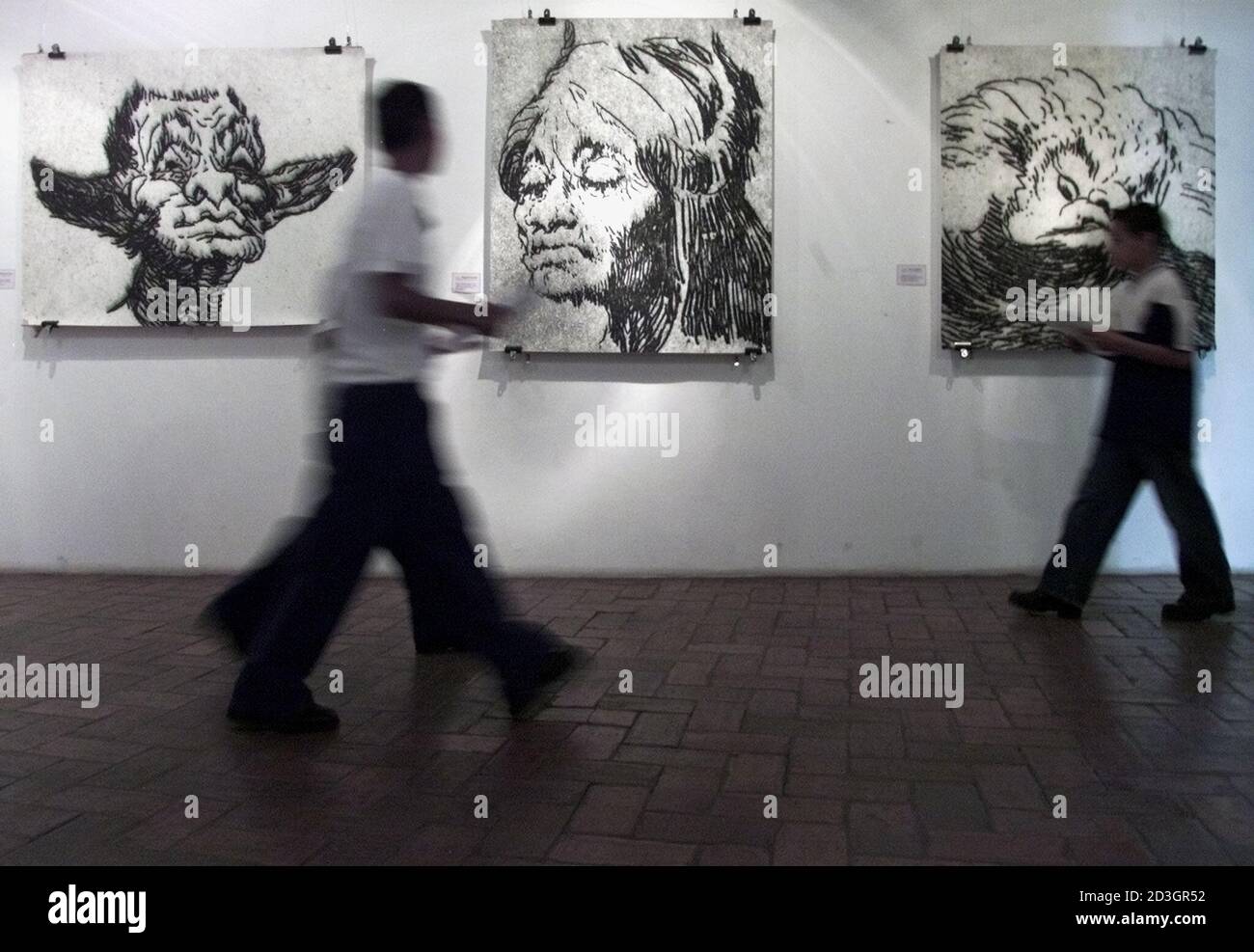 School children study the work of Francisco de Goya at the Honduran