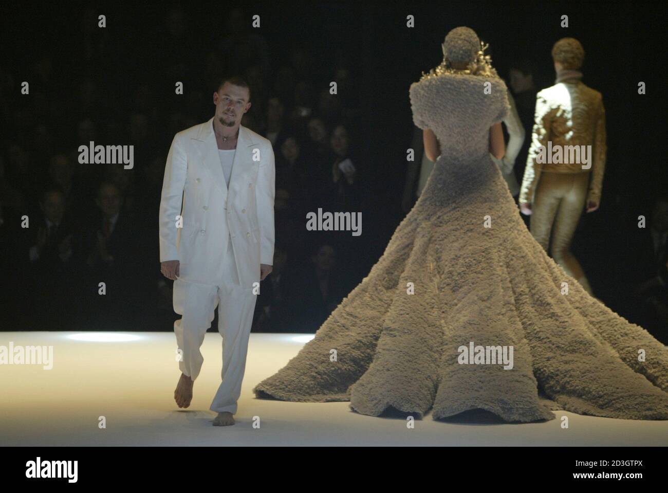 British designer Alexander McQueen appears on the catwalk at the end of his  2004-2005 Autumn/