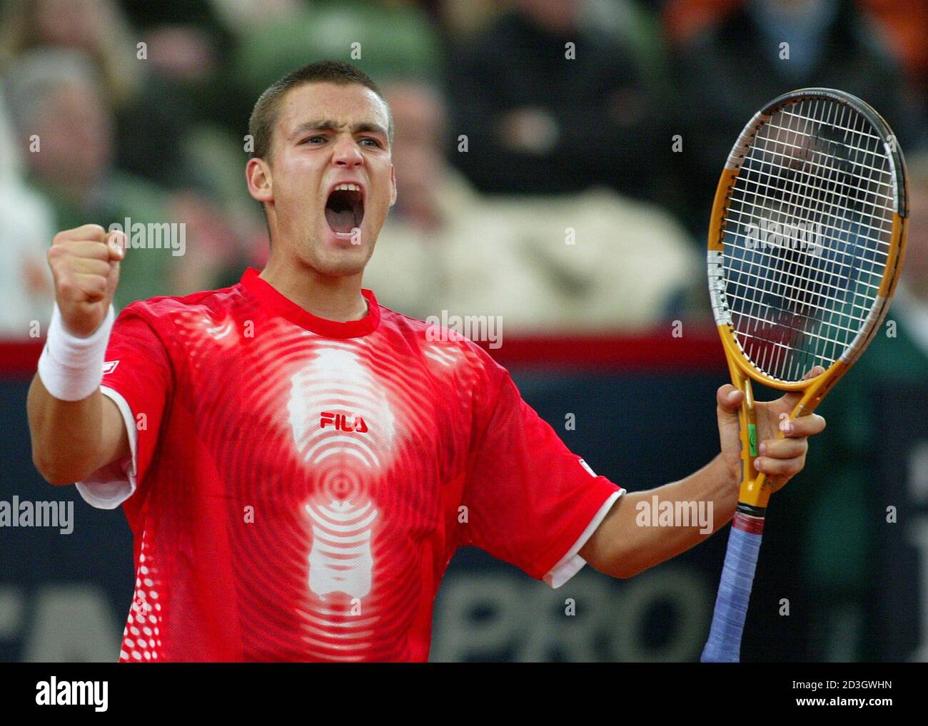 Mikhail Youzhny of Russia celebrates his victory against Florian Mayer from  Germany during the Hamburg Masters Tennis tournament May 13, 2004. Youzhny  won the match 6-0 7-6 and reached the quarter-final. REUTERS/Tobias
