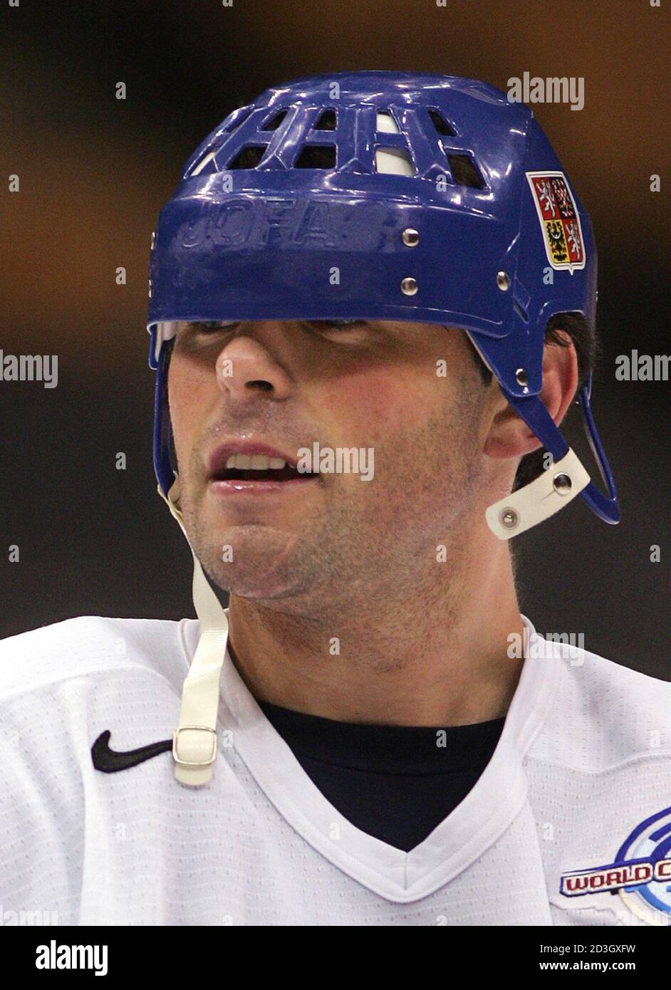 Czech Republic's Jaromir Jagr's helmet slips over his eyes during his  team's practice for the 2004 World Cup of Hockey in Toronto, September 10,  2004. Jagr is skating for the first time