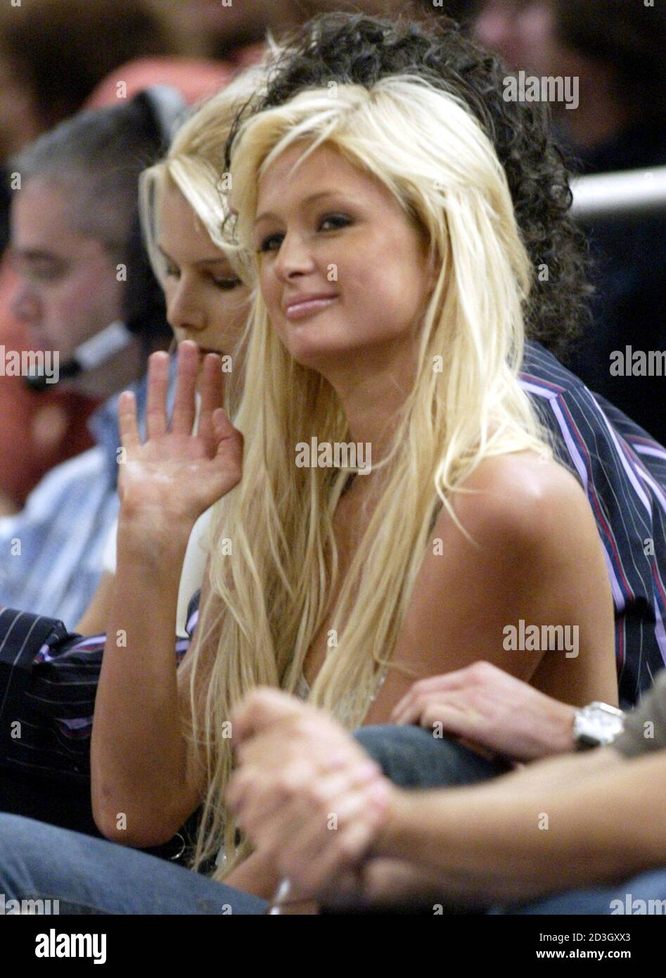 Celebrity personality Paris Hilton waves as she sits at courtside during the first half of the New York Knicks home opening NBA game against the Boston Celtics, in New York's Madison Square Garden, November 6, 2004. REUTERS/Ray Stubblebine  RFS Stock Photo