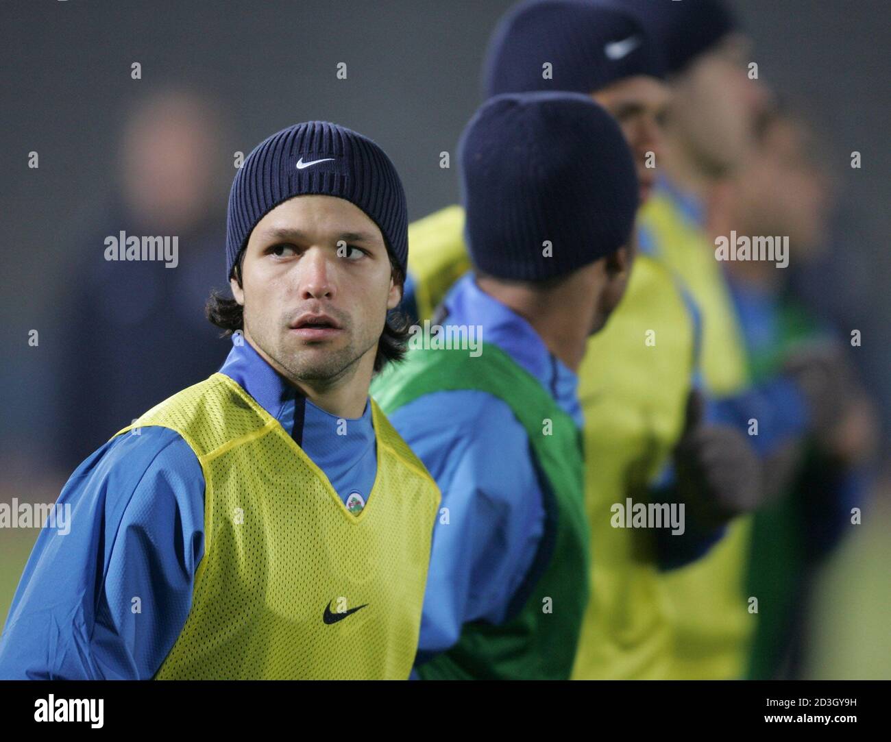 Portuguese FC Porto's midfielder Diego Ribas da Cunha (L) of Brazil and teammates warm up at a practice session in Kawasaki, south of Tokyo December 10, 2004. FC Porto is in Japan for the European-South American Cup club soccer championship against South-American club champion Once Caldas of Colombia on December 12. REUTERS/Issei Kato  IK/FA Stock Photo