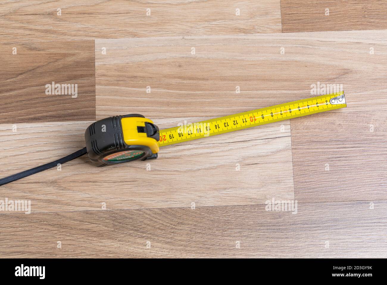 Rolled up red tape measure hi-res stock photography and images - Alamy